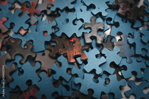 Selective focus of pieces puzzle jigsaw, puzzle background. Jigsaw puzzle color background.