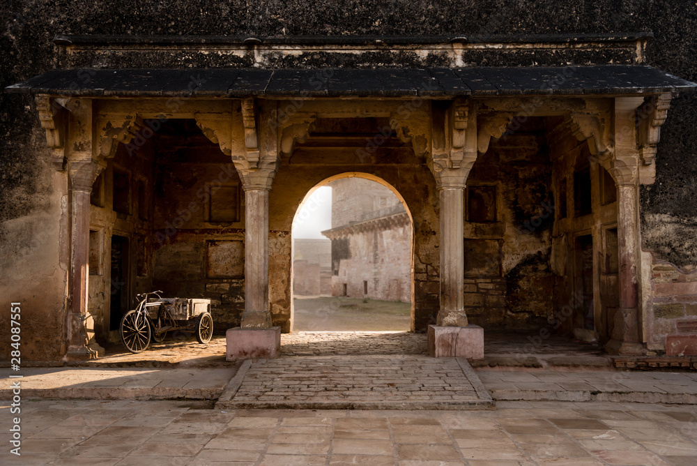 An old bicycle with a storage cart at the ruins of Gwalior Fort in Madhya Pradesh, central India.