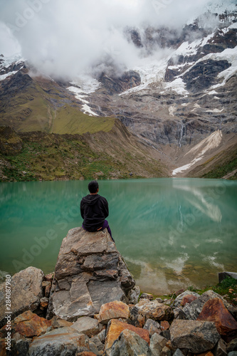 man in front of the Humantay Lake on the Salkantay Trail  the trek to Machu Picchu  Peru