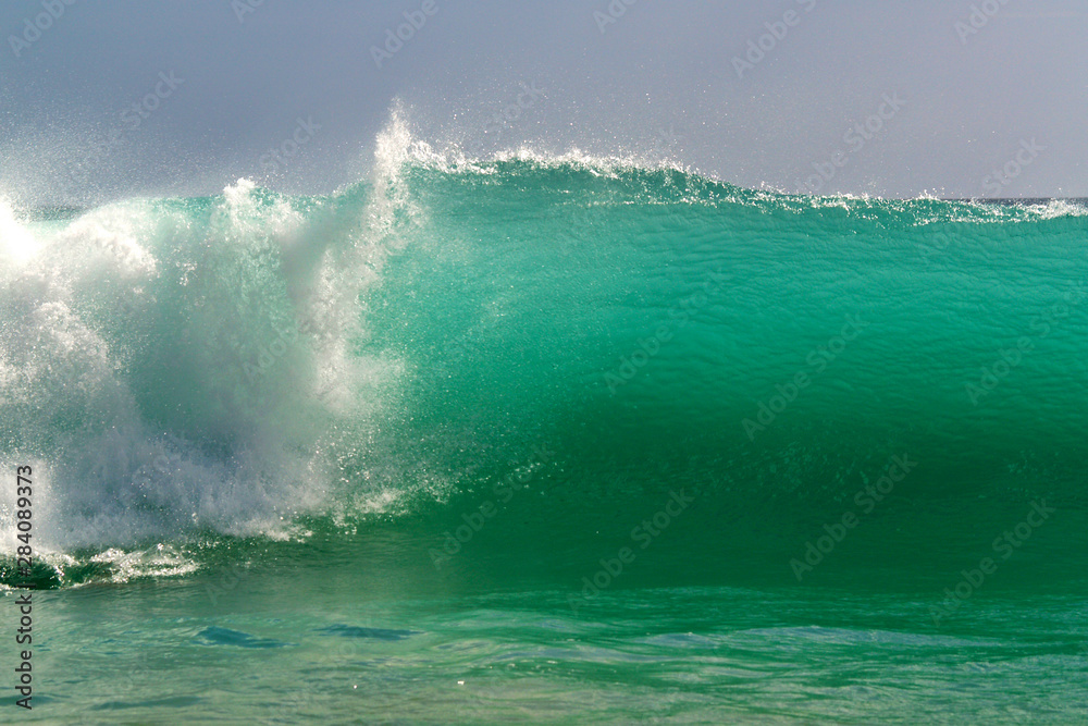 turquoise wave breaking in tropical beach turquoise wave breaking in tropical beach