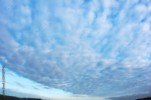 The sky with clouds. Blue sky and clouds. White clouds in the blue sky.