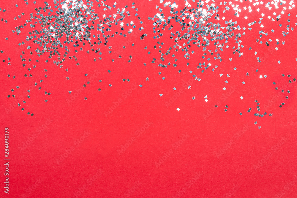 Template with star shaped confetti on red background