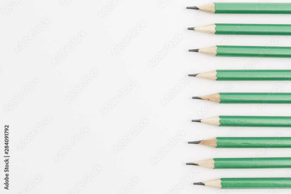 Row of green sharp pencils on white background Row of green sharp pencils on white background