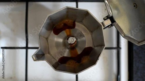Coffee goes up in moka pot on stove
