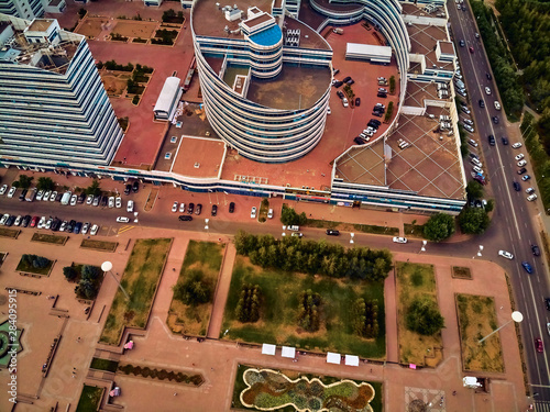 NUR-SULTAN, KAZAKHSTAN (QAZAQSTAN) - July 29, 2019: Beautiful panoramic aerial drone view to Nursultan (Astana) city center with skyscrapers and Baiterek Tower - symbol of Kazakh people freedom photo