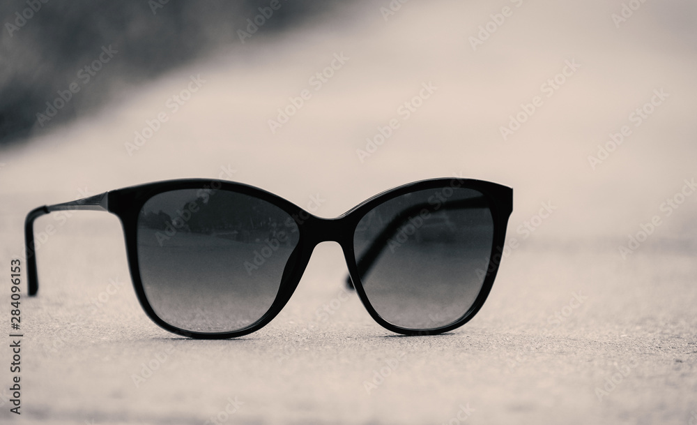 black sunglasses on a gray background