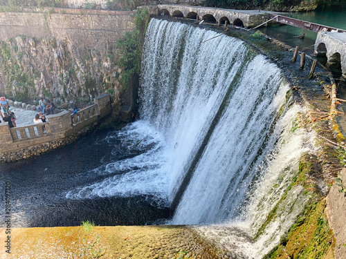 Artificial waterfall on the river Psyrtskha in the summer, the city of New Athos, Abkhazia photo