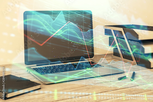 Stock market chart and desktop office computer background. Multi exposure. Concept of financial analysis.