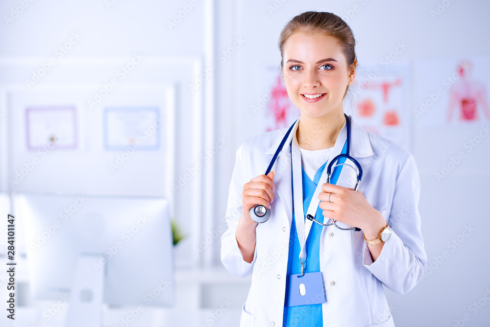 Doctor with stethoscope in the office on a white background in a hospital Doctor with stethoscope in the office on a white background in a hospital