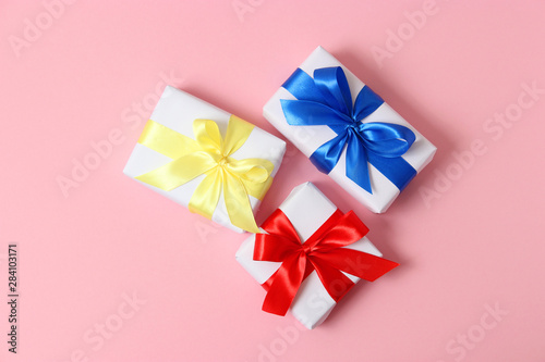 gifts on a colored background top view. Holiday  giving presents  birthday.