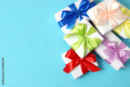 gifts on a colored background top view. Holiday  giving presents  birthday.