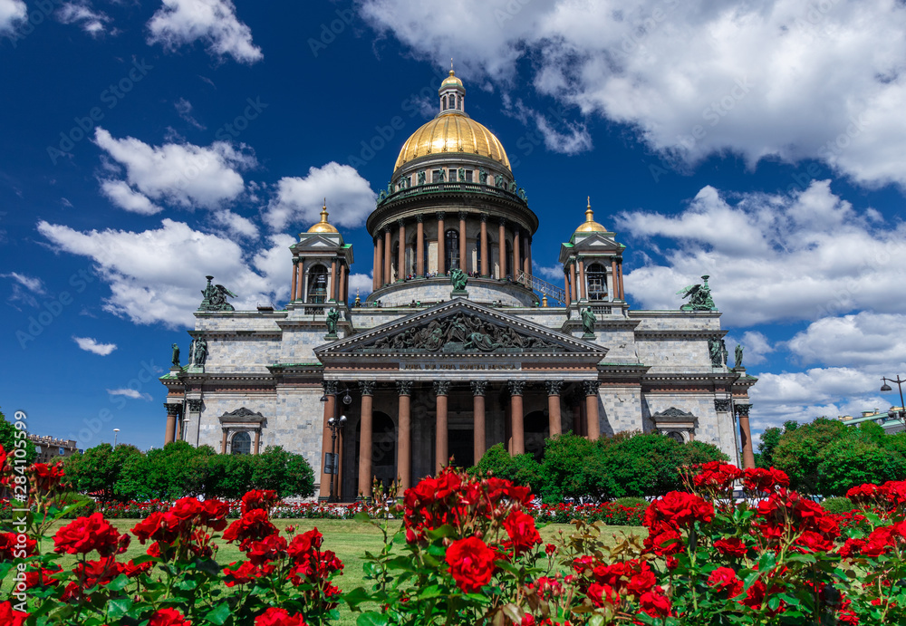 St. Isaac's Cathedral in St. Petersburg, Russia. Sunny day, blue bright sky and white clouds.