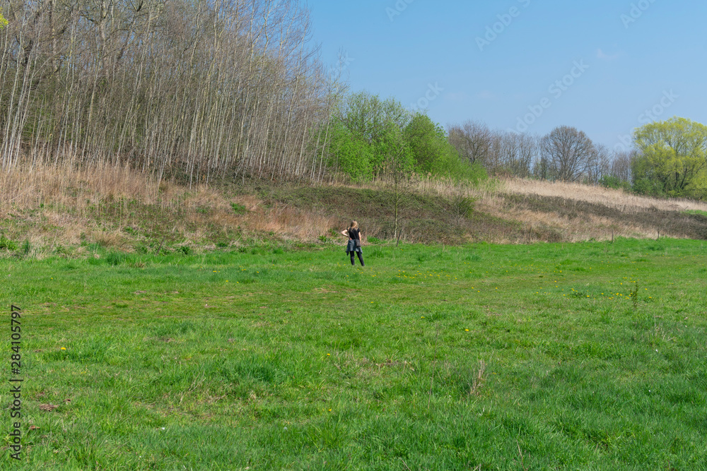 Beautiful landscape photo taken in the summer and in the middle a blonde woman who admired nature