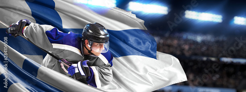 Canvas Print Finland Hockey Player in action around national flags