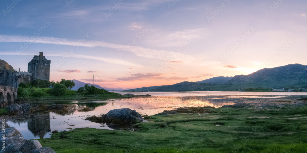 Panoramic view of Eilean Donan Castle at dusk, Highlands, Scotland, UK