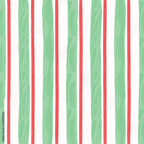 Vertical aged stripes with ragged edges and paint effect. Vector seamless pattern.