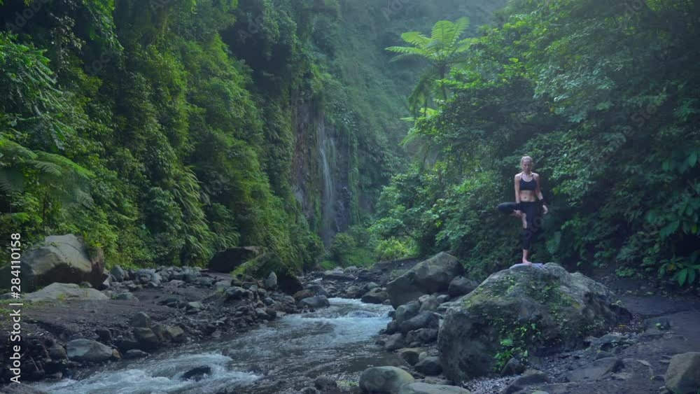 Serenity and yoga practicing at nature, river with waterfall Serenity and yoga practicing at nature, river with waterfall