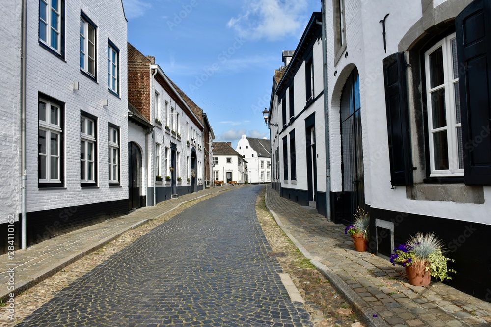 Street in the picturesque white village of Thorn, Limburg, Holland
