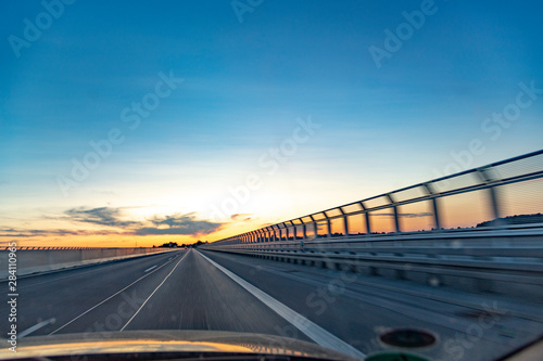 car in the evening on a german highway with speed