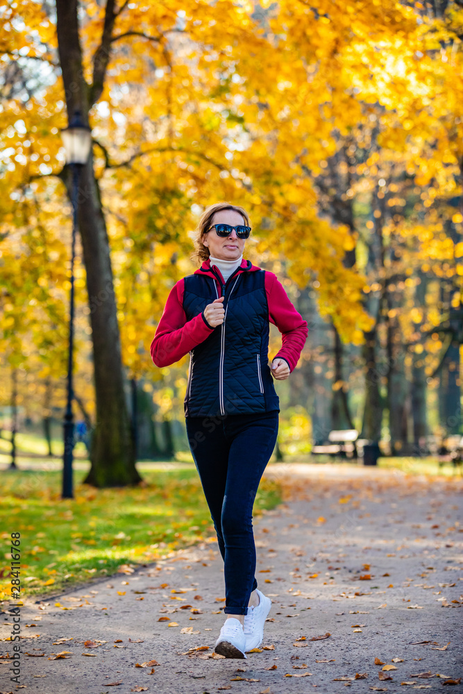 Healthy lifestyle - woman running in city park Healthy lifestyle - woman running in city park