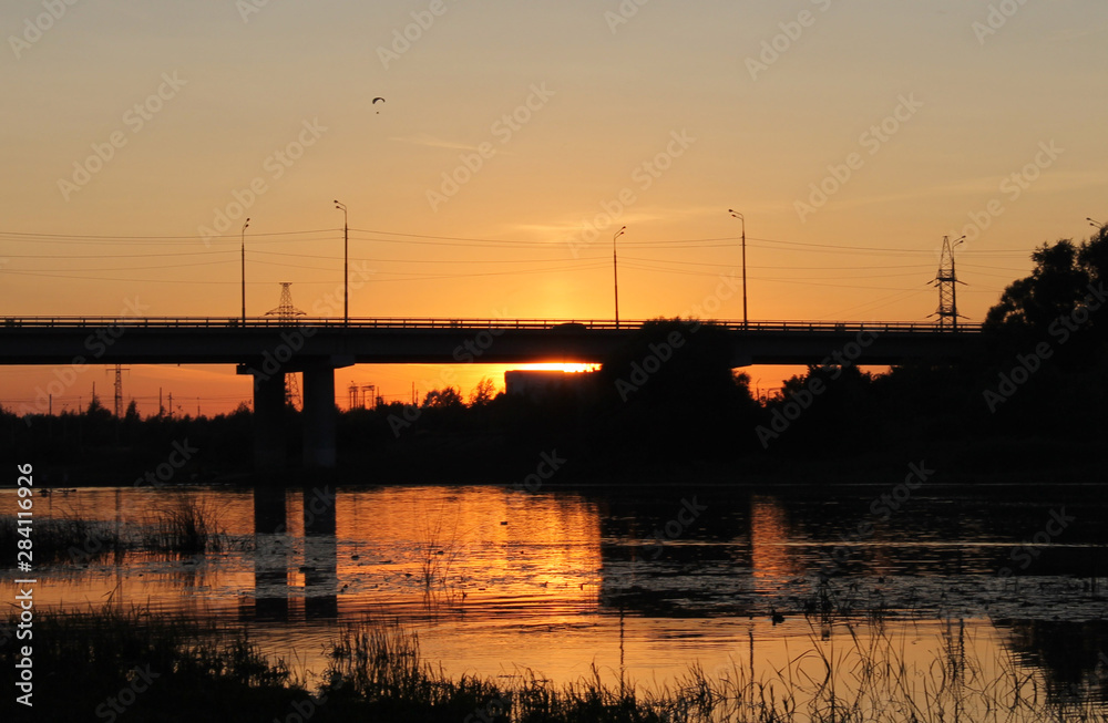Sunset on the river. The famous bridge against a beautiful sky. Picture for wallpaper