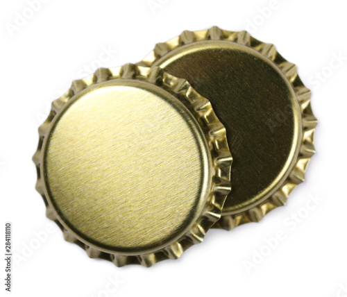 New golden bottle cap for beer isolated on white, top view, macro