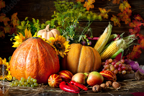 The table, decorated with vegetables and fruits. Harvest Festival. Happy Thanksgiving. Autumn background. Selective focus.
