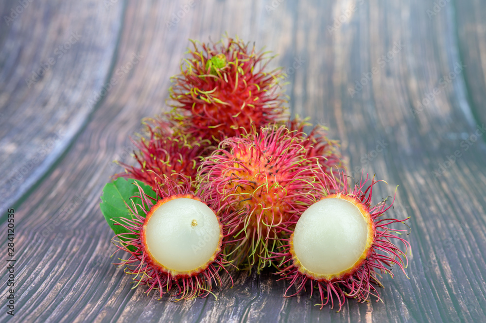 Fresh Rambutan on wooden table background Fresh Rambutan on wooden table background