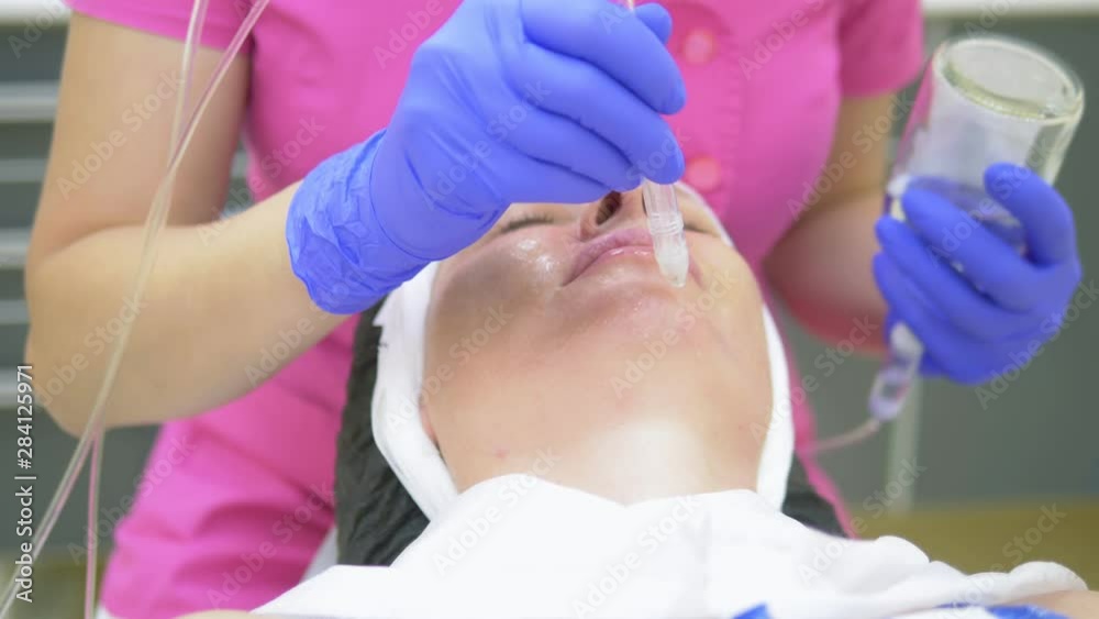 cosmetology concept, face care. woman face during the procedure of jet peeling, facial cosmetology concept, face care. woman face during the procedure of jet peeling, facial