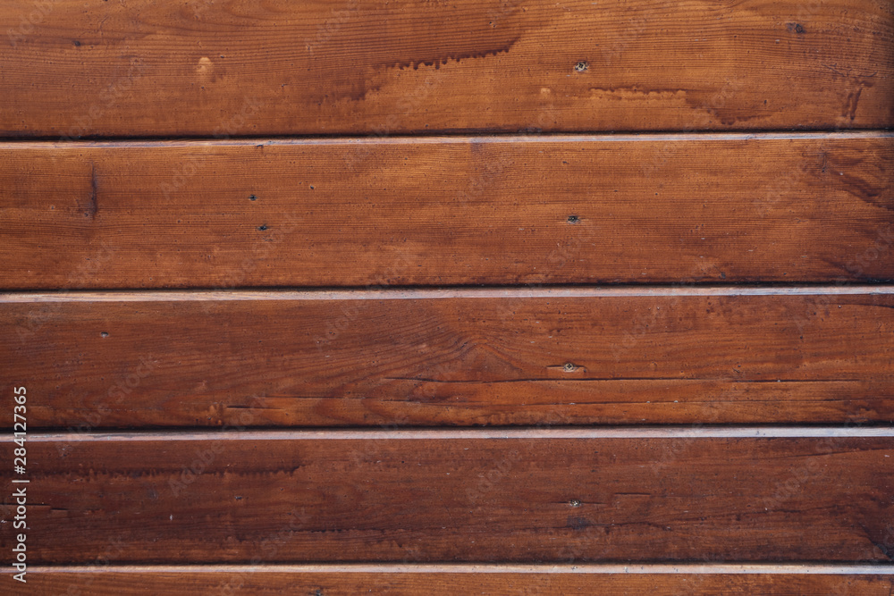 Dark wooden background. Striped brown wood background Dark wooden background. Striped brown wood background