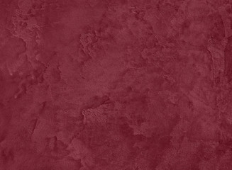 Dark red Concrete textured background to your concept or product. Winter 2020 color trend.