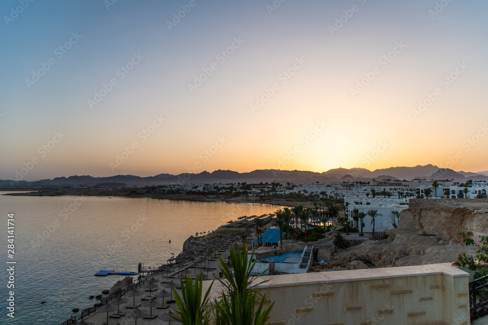Sharm Al Sheikh, Egypt- May,2019: Tropical luxury tourist resort. Stunning evening view of Red Sea and colorful vibrant sky after sunset view to the Red Sea. Sinai peninsula