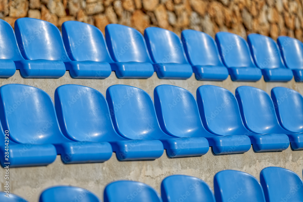 Fototapeta premium Blue Chairs At The Stadium