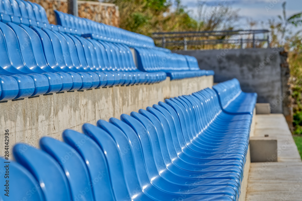 Fototapeta premium Blue Chairs At The Stadium