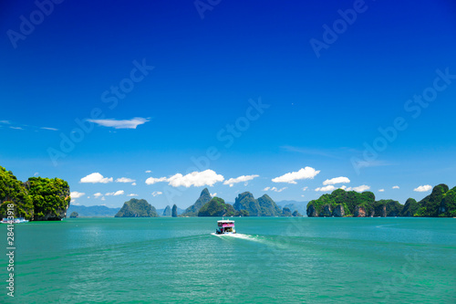 Boat in the ocean with islands