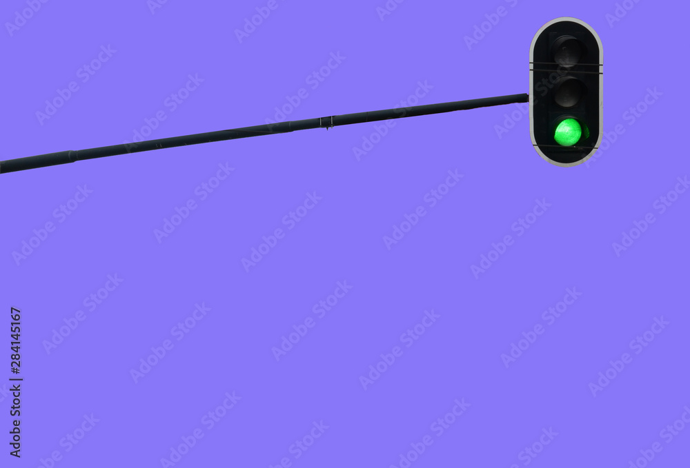 Traffic light with green color isolated on blue sky background, road, driving, transport, allowance, solution or yes concept Traffic light with green color isolated on blue sky background, road, driving, transport, allowance, solution or yes concept