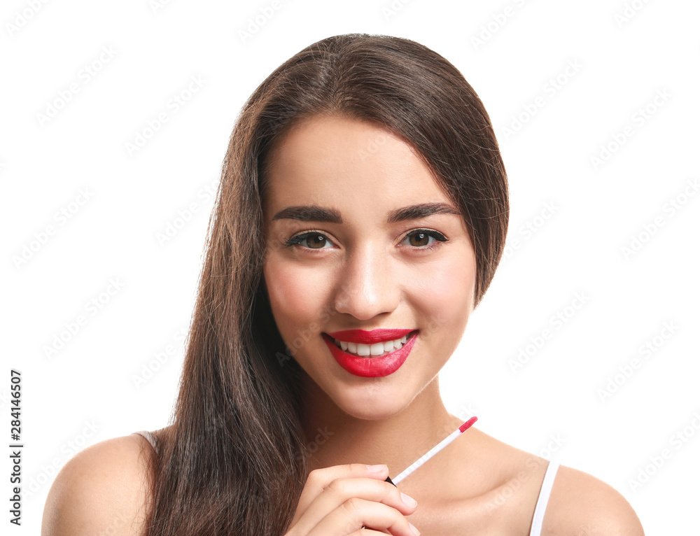 Beautiful young woman with lipstick on white background Beautiful young woman with lipstick on white background