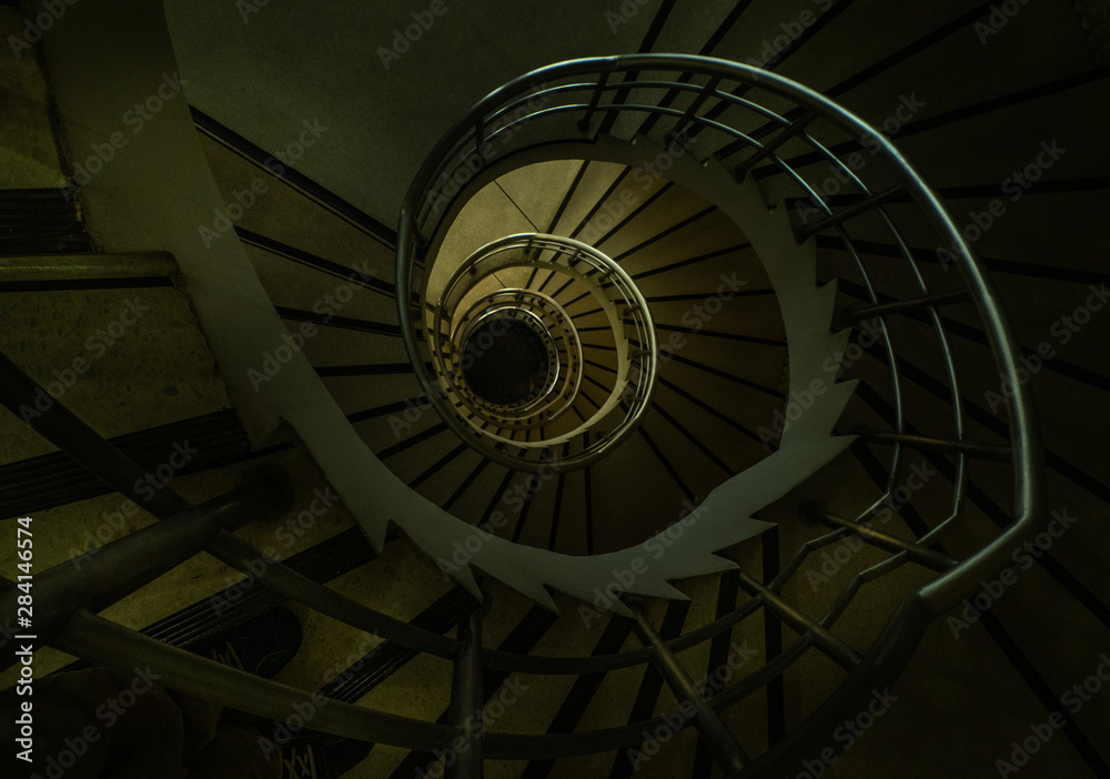 The spiral staircase detail in a beautiful of the building.