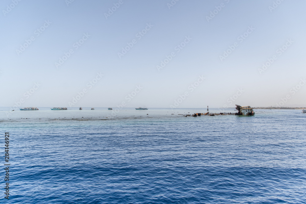 Sharm El Sheikh, Egypt - May, 2019: Shipwreck near the island of Tiran - attraction of the resort of Sharm Sharm El Sheikh, Egypt - May, 2019: Shipwreck near the island of Tiran - attraction of the resort of Sharm