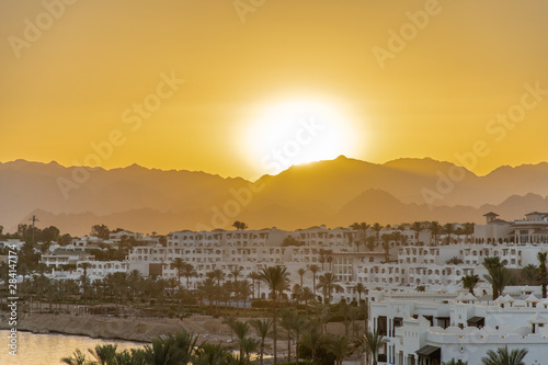 Sharm el Sheikh, Egypt - May, 2019: Panorama of the beach with umbrellas at the reef on sunset, Sharm el Sheikh, Egypt © F8  \ Suport Ukraine