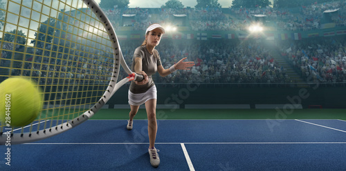 Female athlete plays tennis on a professional court © Alex