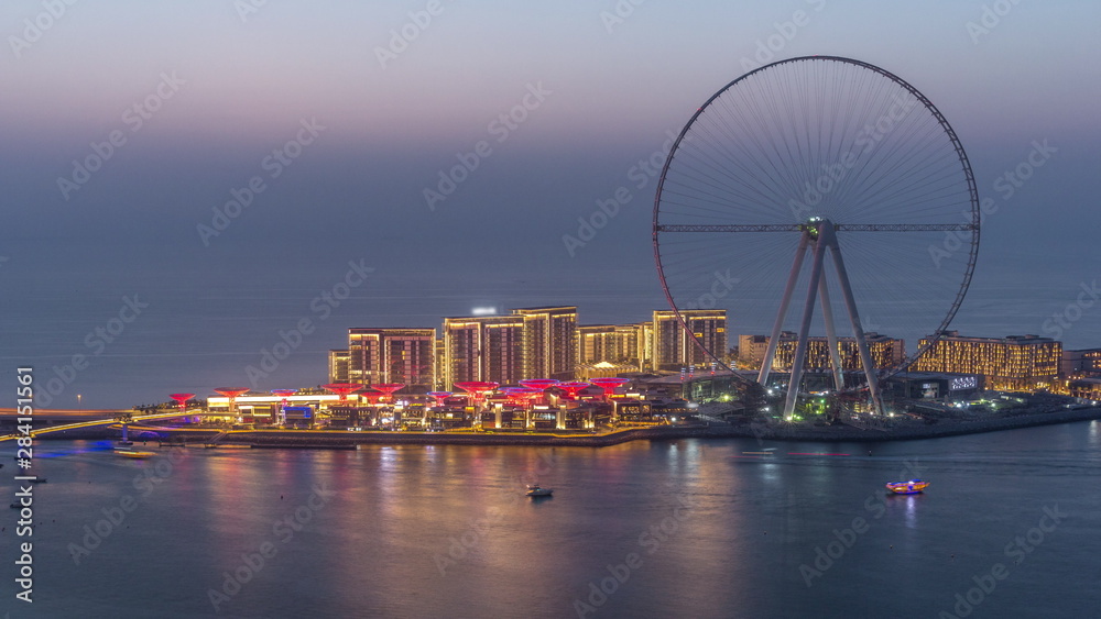 Obraz premium Bluewaters Island in Dubai aerial day to night timelapse after sunset.