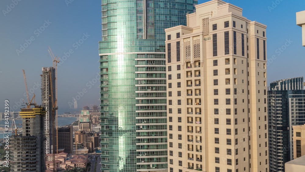 Obraz premium Modern skyscrapers in Jumeirah beach residence in Dubai, JBR aerial timelapse
