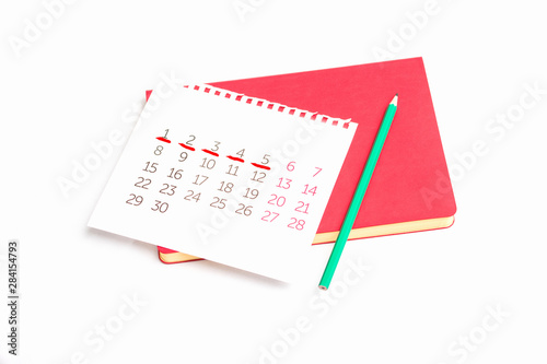 Calendar, pencil and notebook, chart menstrual cycle, white background, copy space