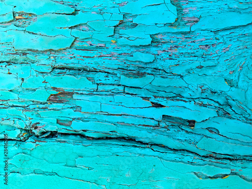 Turquoise color old board, background. Piece of wood, rough surface.