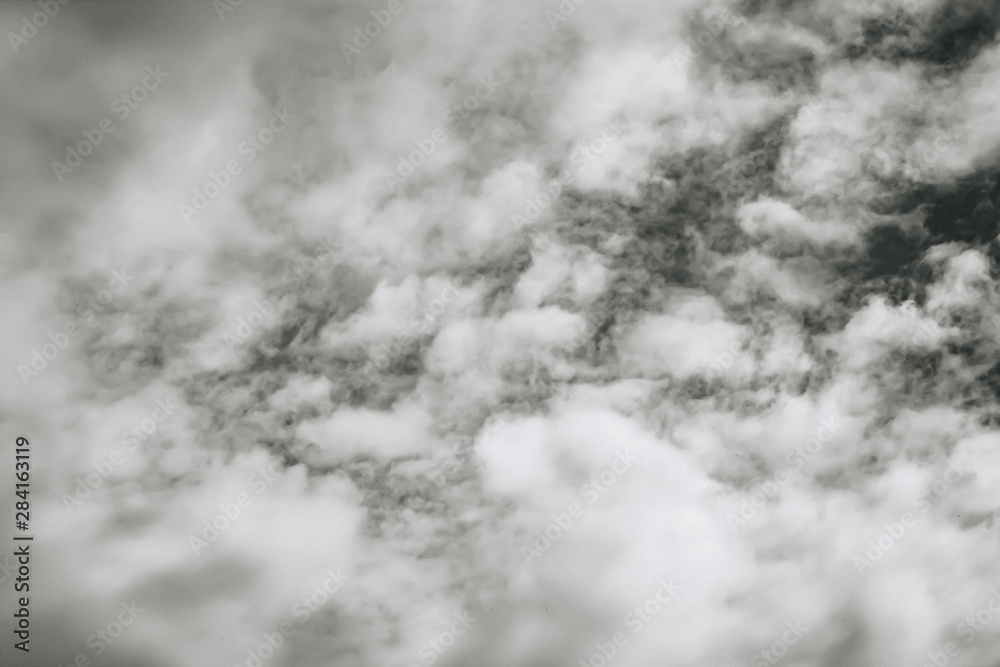 White clouds in the dark sky, thunderstorm. monochrome. White clouds in the dark sky, thunderstorm. monochrome.
