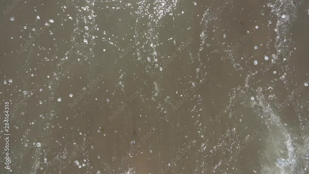 man running into the waves of the ocean man running into the waves of the ocean