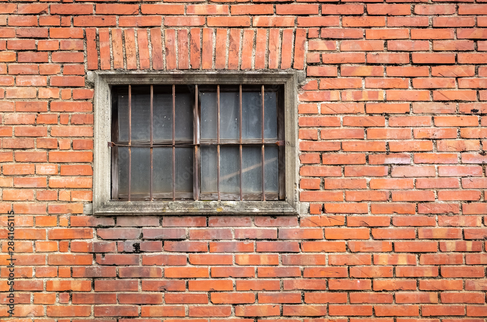 old window on red brick wall
