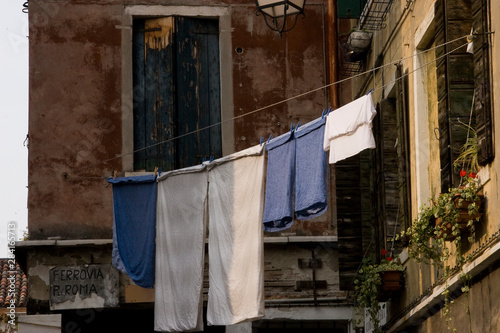 Venice winter mysterious romantic: ropes tied between facades forming clotheslines with clothes hanging © ttl.photos