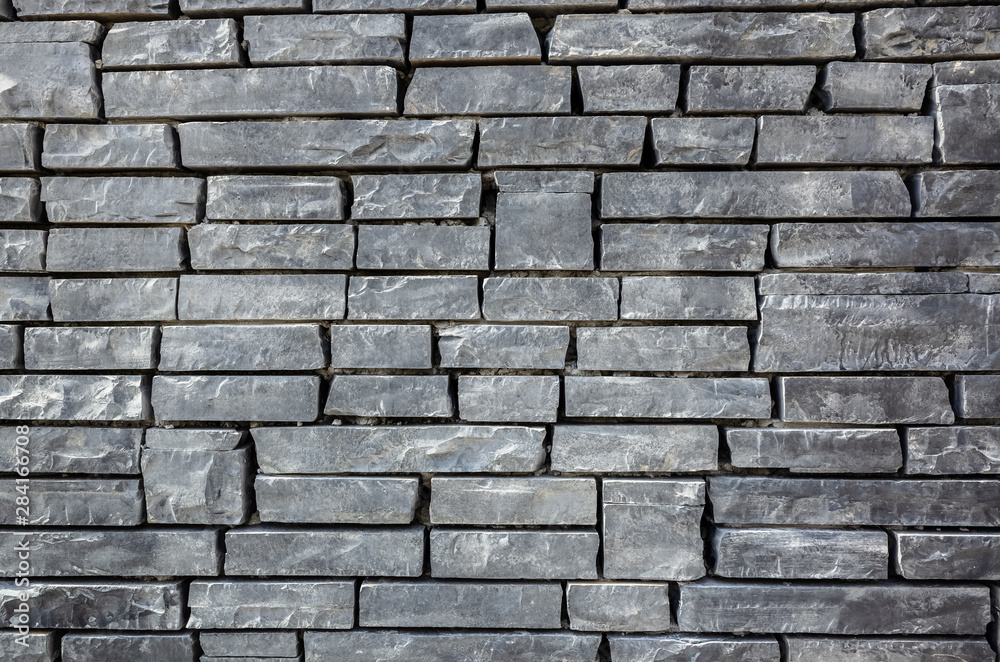 Obraz premium gray brick wall with rough texture